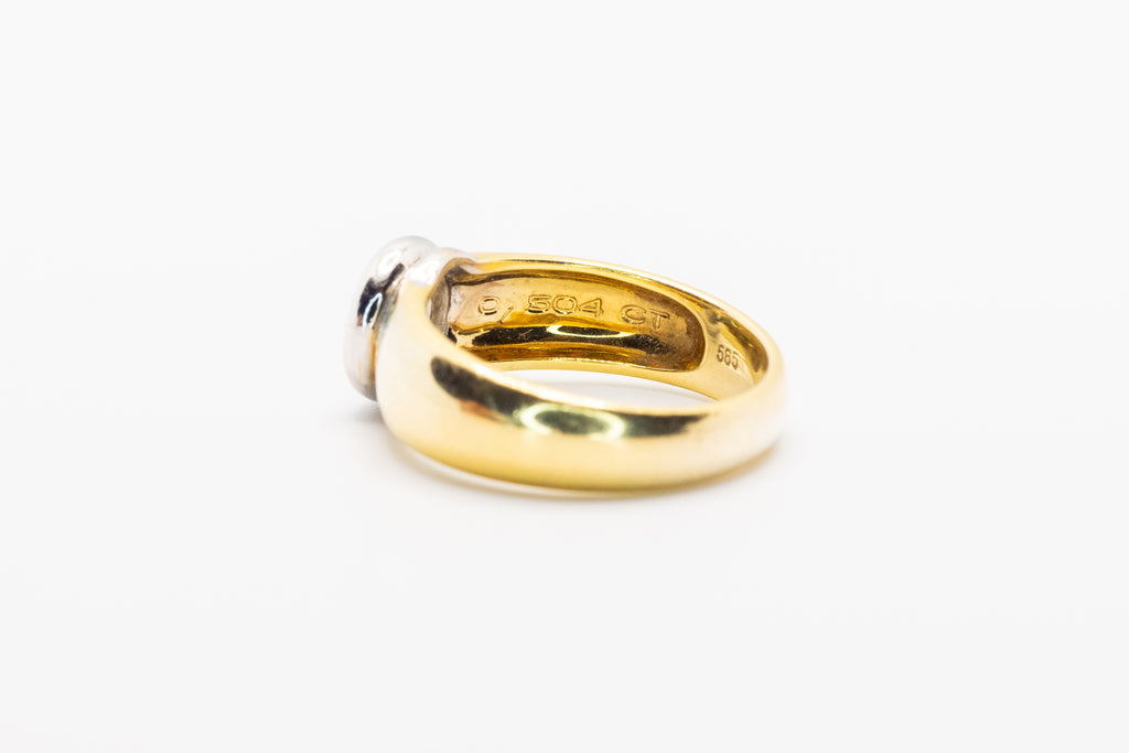 Złoty pierścionek z brylantem 0,8ct