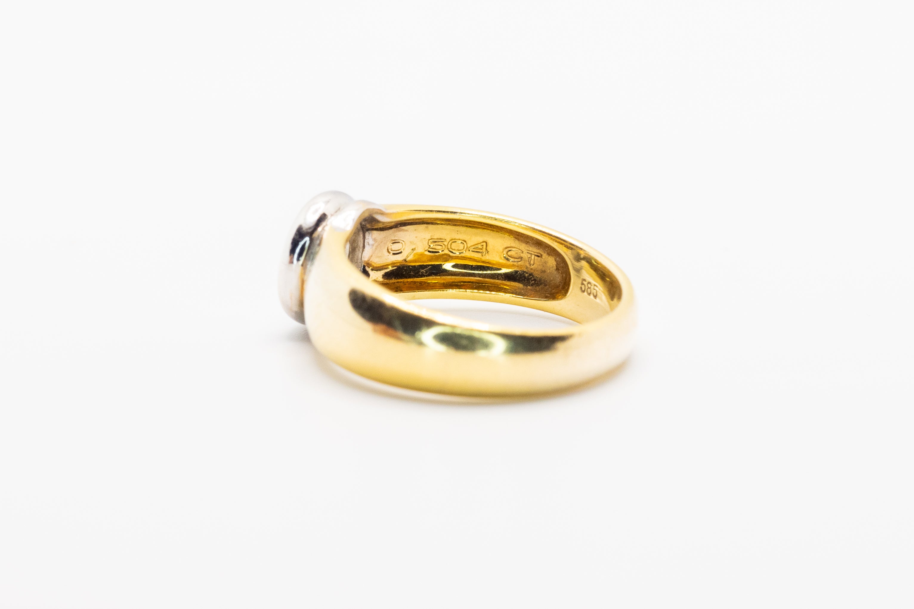Złoty pierścionek z brylantem 0,8ct